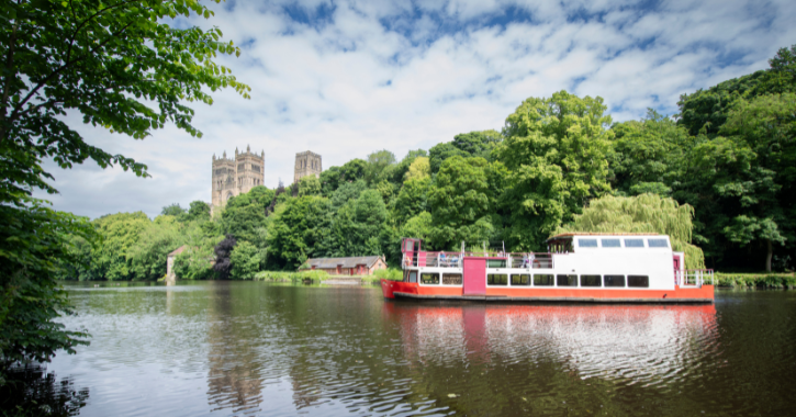 Prince Bishops River Cruiser on the River Wear, Durham City with Durham Cathedral in the background.